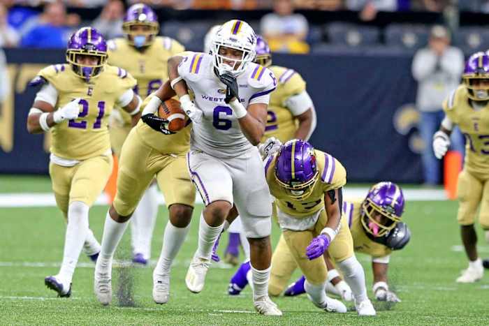 Westgate tight end Danny Lewis, Jr. shakes defenders on a long gain in the third quarter during the Class 4A State Championship game between Westgate and Warren Easton at the Caesar Superdome on Friday, December 10, 2021.